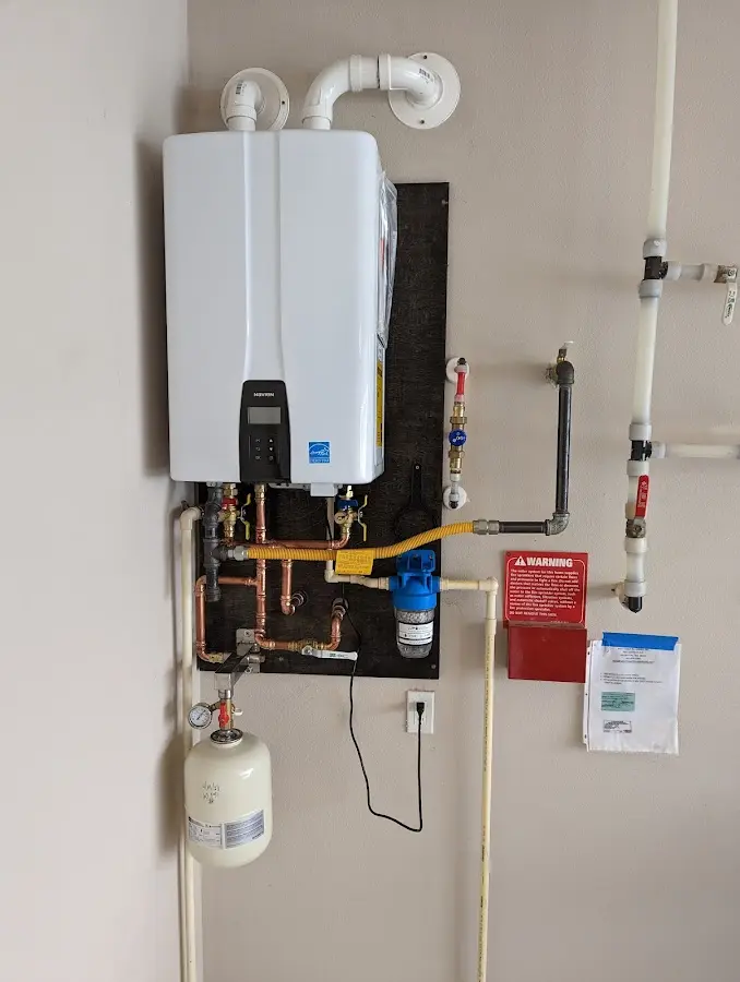 Professional plumber installing copper piping in a North Miami Beach home